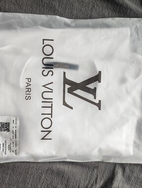 BRAND NEW WHITE TSHIRT WITH TAGS AND PACKAGING